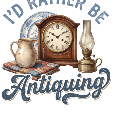 Decorative graphic with antique clock, pitcher, and lamp with 'I'd Rather Be Antiquing' fabric panel