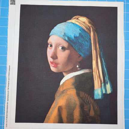 Print of 'Girl with a Pearl Earring' by Johannes Vermeer on a blue grid background fabric panel