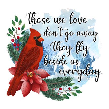 A fabric panel featuring a red cardinal bird with floral elements and the text 'Those we love don't go away, They fly beside us everyday.'.