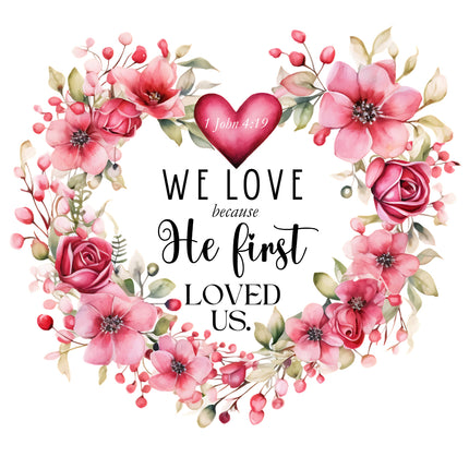 A 100% cotton fabric panel block featuring a floral design with the text 'WE LOVE because He first LOVED US' printed on it.