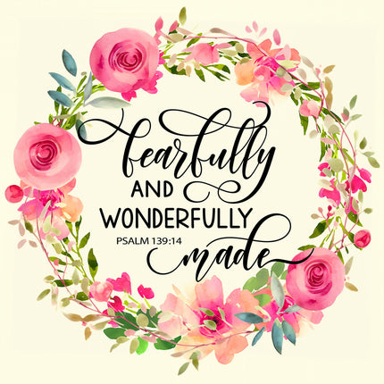A fabric panel with a floral wreath surrounding the text 'Fearfully and Wonderfully Made' from Psalm 139:14.