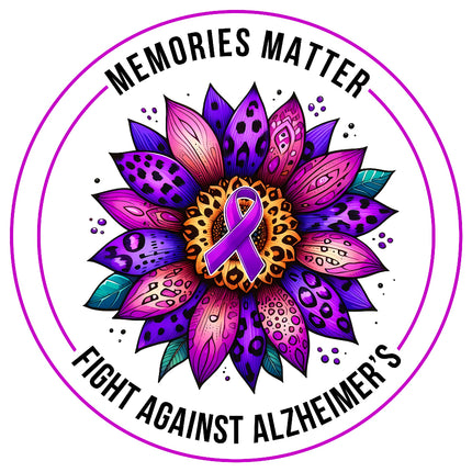 A fabric panel block with a purple ribbon symbol in the center, surrounded by a multicolored floral pattern, with the text 'MEMORIES MATTER FIGHT AGAINST ALZHEIMER'S'.