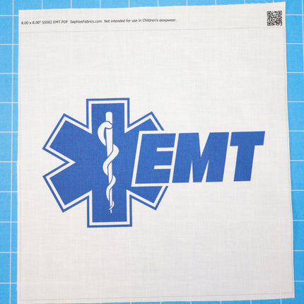 Blue EMT symbol on a white fabric square with a blue grid background